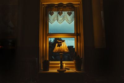 Lamp by the window on a rainy day