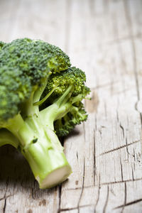 Close-up of broccoli on wooden table