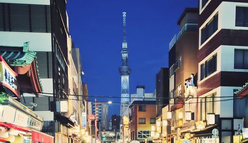 Low angle view of buildings against blue sky