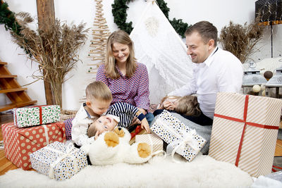 Happy family with three children celebration christmas at home