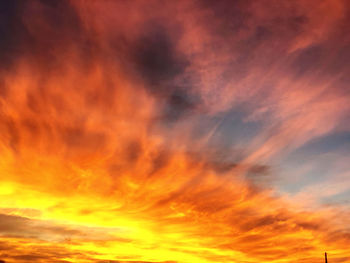 Low angle view of dramatic sky during sunset
