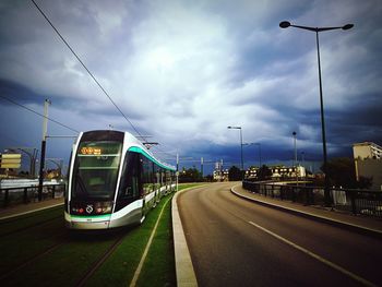 Cars on road against sky