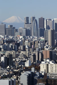 Tokyo cityscape against clear sky