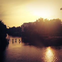 Scenic view of river at sunset