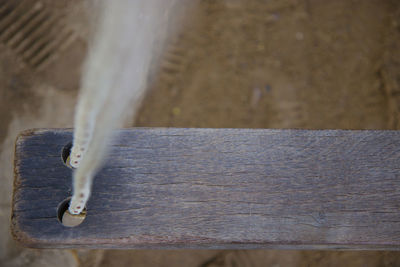 Close-up of old metal chain against wall