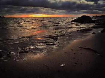 Scenic view of sea against cloudy sky