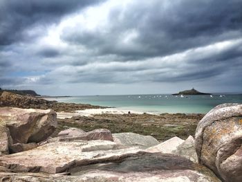 Scenic view of sea against cloudy sky