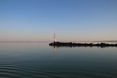 Scenic view of sea against clear sky during sunset