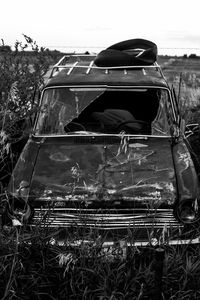 Close-up of motorcycle against plants