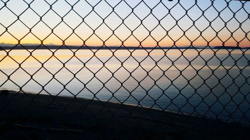 Close-up of chainlink fence against clear sky