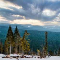 Scenic view of snow covered mountains against sky