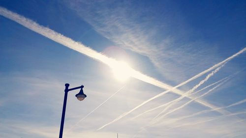 Low angle view of floodlight against sky