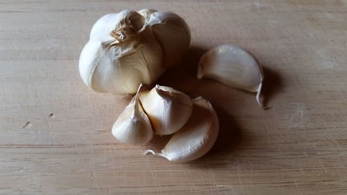 Close-up of garlic on cutting board