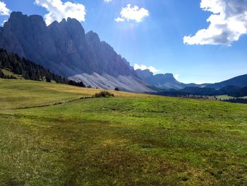 Scenic view of green landscape and mountains