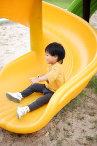 High angle view of cute girl playing in playground