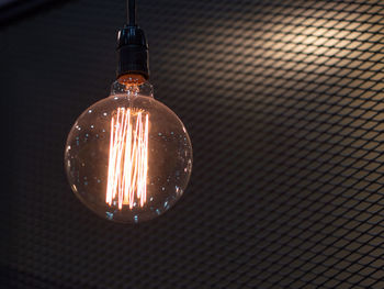 Close-up of illuminated light bulb