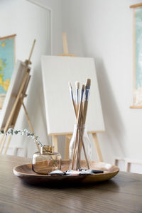 Paint brushes in artist studio