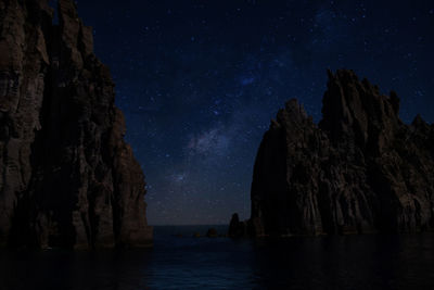 Panoramic view of rocks at night