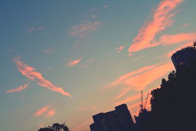 Low angle view of silhouette trees against sky at sunset