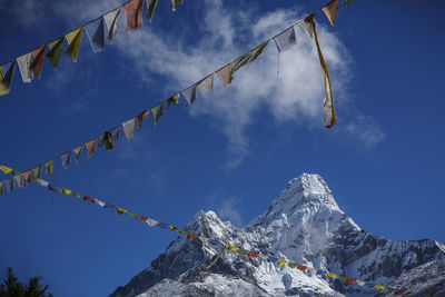 Prayer flags beneath ama dablam, near the trail to everest base camp