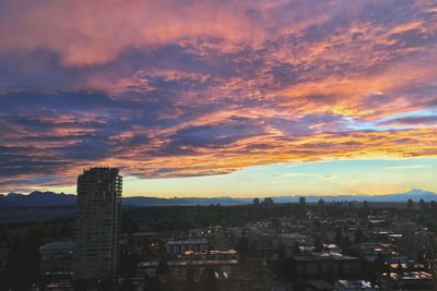 Cityscape against dramatic sky