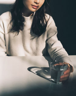 Woman holding coffee cup