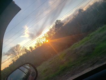 Scenic view of sky seen through car window