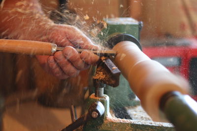 Close-up of man working in workshop