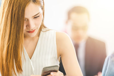 Young woman using mobile phone