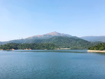 Scenic view of mountains against clear blue sky