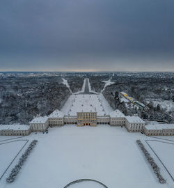 Buildings in city against sky during winter