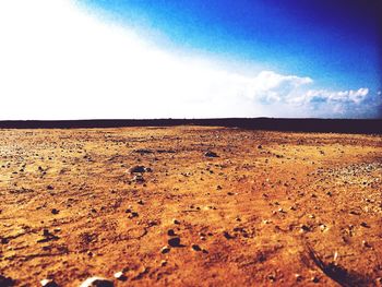 Scenic view of landscape against cloudy sky