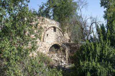 Low angle view of arch bridge against sky