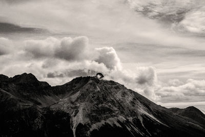 Low angle view of mountain range against sky