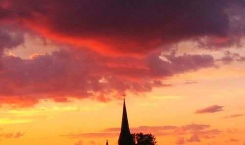 Low angle view of dramatic sky during sunset