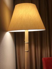 Close-up of electric lamp at home