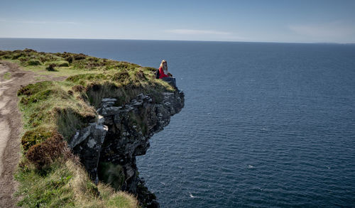 Panoramic view of rocks on sea against sky