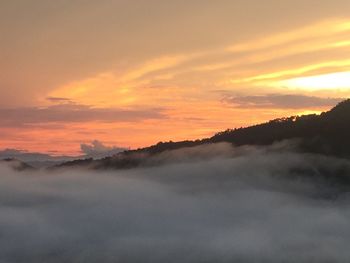 Scenic view of mountains against sky during sunset