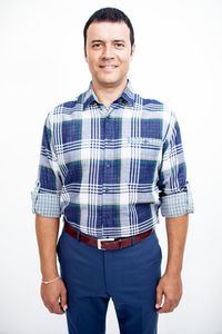 Portrait of a smiling young man against white background