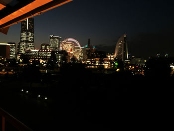 Illuminated cityscape at night