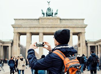 Rear view of people photographing