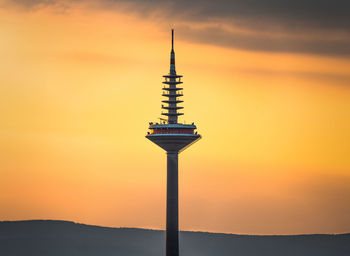 Low angle view of tower during sunset