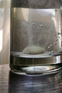Close-up of water in glass on table