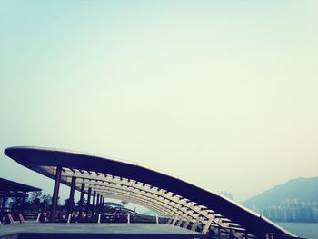 People in water against clear sky
