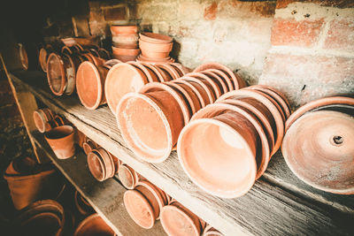 High angle view of pots on shelves