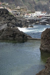 Scenic view of sea and buildings