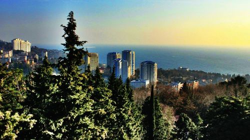 City skyline against blue sky