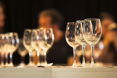 Close-up of wineglasses on table