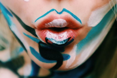 Close-up of woman with face paint