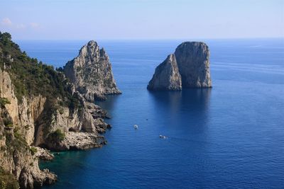 Scenic view of sea against clear blue sky